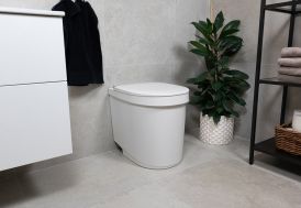 Toilettes sèches Tiny avec son bidon d'urine dans une salle de bain